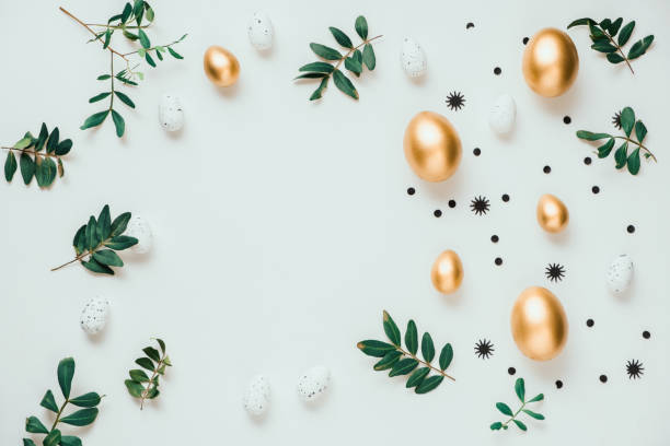 istock Golden eggs with green tree. Easter decoration background. Top view 2039968288
