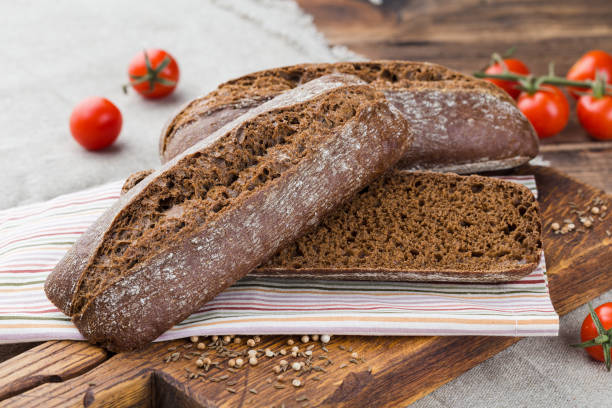istock Rye baguette on wooden background 2039972658