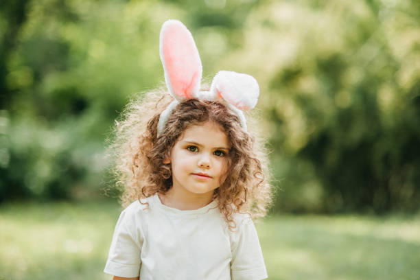 istock Baby with basket full of colorful eggs. Easter egg hunt. 2039975821