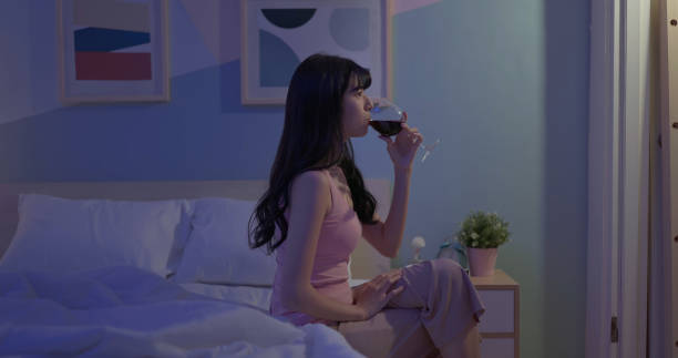 istock asian woman red wine bedtime 2039979766
