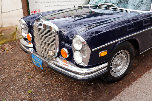 Poznan, Poland – February 25, 2024: A parked classic Mercedes Benz car in a park in Poznan, Poland