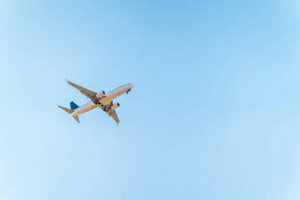 Airplane before landing in blue sky, Boeing 737-800. Air Transport. Tourism and travel concept.