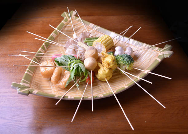 cold mixed raw meats, seafood, vegetable, mushroom, satay, beancurd, hot dog in stick for lok lok steam boat hot pot ingredient in basket asian halal food cuisine buffet menu for hotel restaurant