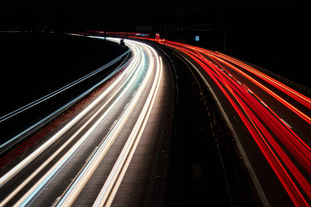 istock Light trails on the highway at night 2040015727