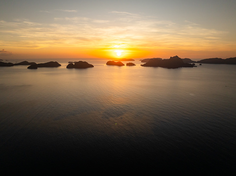 Orange sky over the Islands. Sunset view in El Nido. Palawan, Philippines.