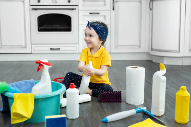 istock Small girl plays with a spray gun while cleaning the kitchen. 2040036681