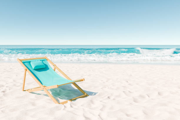 3D rendering of a single aqua-colored beach chair on a white sandy beach with vibrant ocean waves in the background. Peaceful vacation concept.