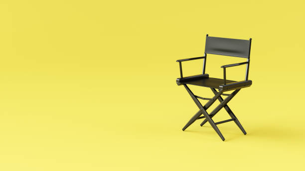 istock Black Director Chair on yellow background. Summertime. 2040056969