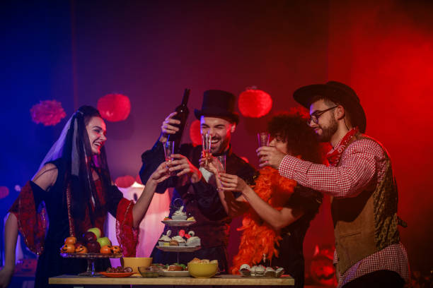 istock Pouring red wine to enjoy during a fun Halloween party 2040080333