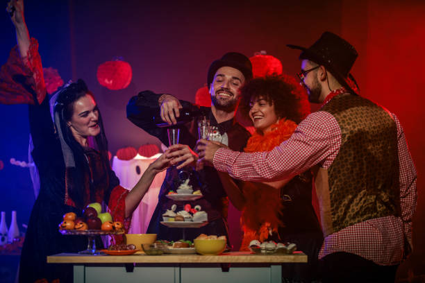 istock Pouring red wine to enjoy during a fun Halloween party 2040080337