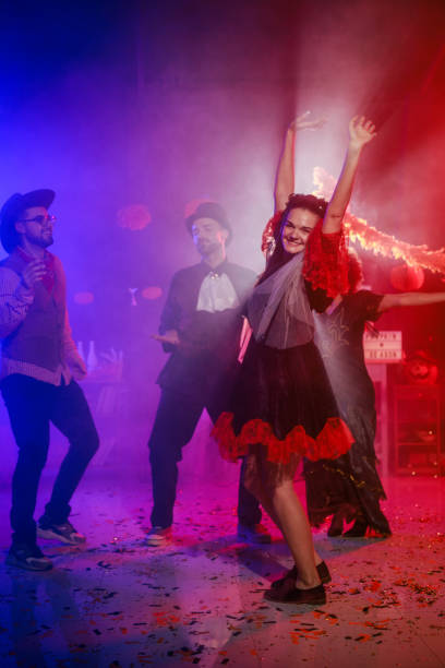 istock Having fun and dancing in costumes during a Halloween party 2040080885