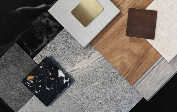 istock close up view of composition of interior material samples including stone granite tiles, terrazzo, wooden vinyl flooring tiles, gold stainless, grainy quartz placed on black marble background. 2040084068