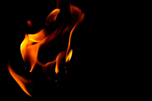 close up of fire burning in the dark