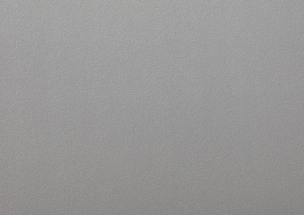 Background of gray paper wallpaper or plastered wall.