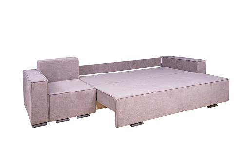 Pink unfolded sofa made of velor fabric isolated on a white background. Cushioned furniture.