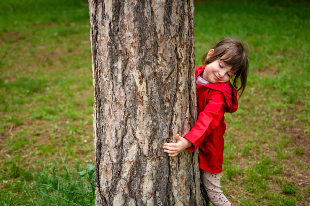 istock Cute little girl playing in the park during spring day. 2040120688