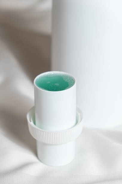 istock Natural liquid laundry detergent on a background of white satin fabric. 2040128727