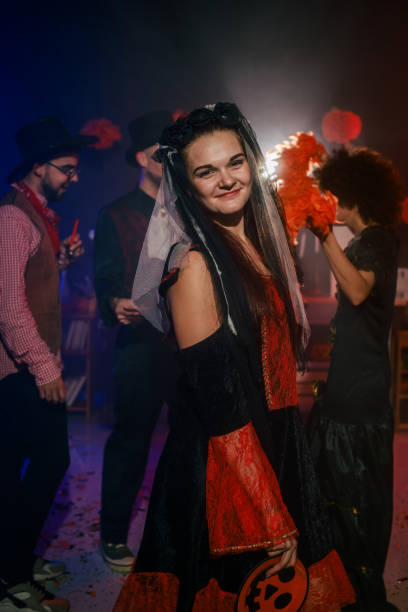 istock Charming young woman dancing in costume during a fun Halloween party 2040135525