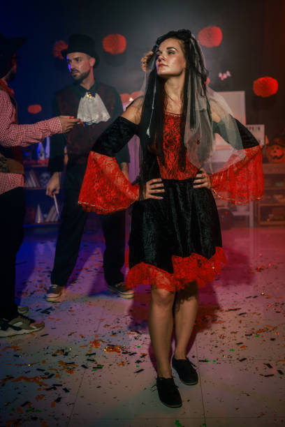 istock Charming young woman dancing in costume during a fun Halloween party 2040135536