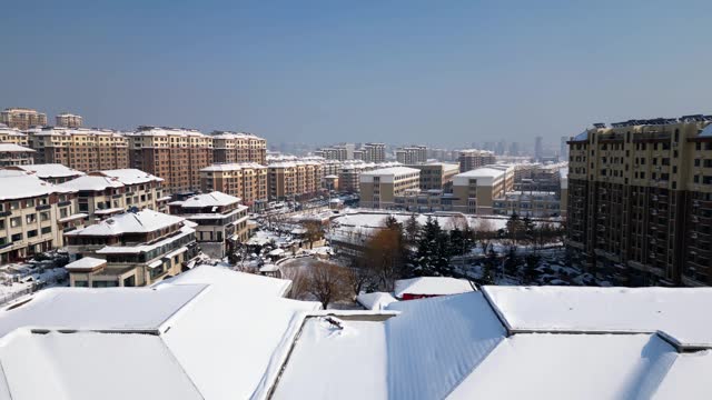 Aerial View of Winter Cityscape Amidst Heavy Snowfall