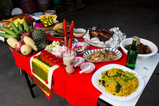 Sacrificial offerings food set for respect blessing to chinese deity folk religion of taoism god and memorial to ancestor in Chinese new year at house home on February 10, 2022 in Nonthaburi, Thailand