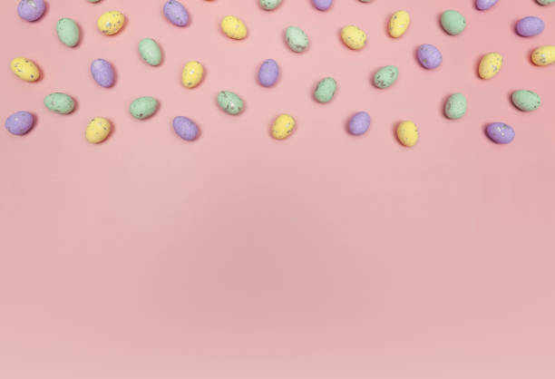 istock Top view of colourful easter eggs on pink background. 2040158567