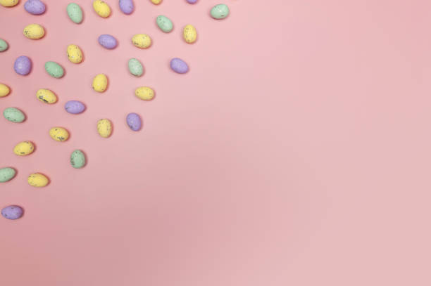 istock Top view of colourful easter eggs on pink background. 2040158569