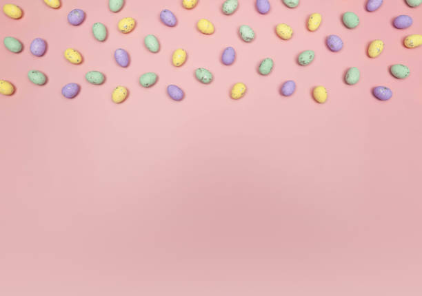 istock Top view of colourful easter eggs on pink background. 2040159119
