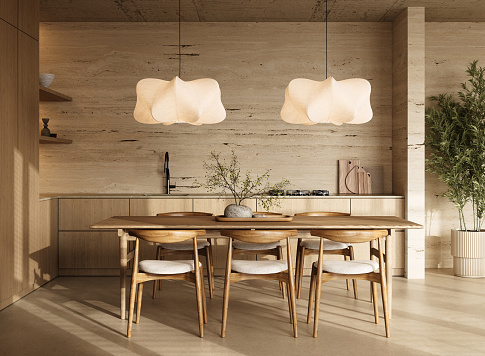 An elegantly arranged kitchen dining space featuring unique pendant lighting and a wooden dining set in a contemporary interior