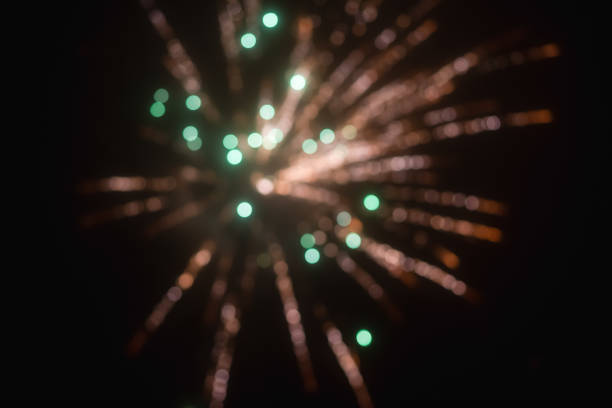 Abstract blurred beautiful firework for background.colorful firework for celebration.Festive fireworks colorful display dark background.Beautiful light for celebration.Happy new year 2022 wallpaper.