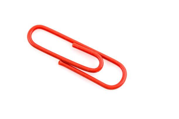 Two magnetic bag clips are sealing a potato chip bag. The clips are red and yellow. There is copy space at the top of the image.