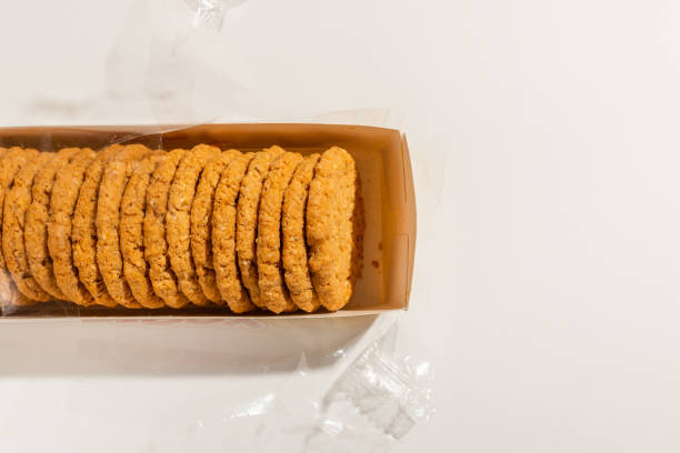 istock Cookies, Biscuits Pack on White Background.Pack of biscuits, wrapped with transparent plastic.Studio shot,top view.copy space. 2040220380