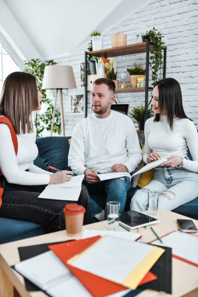 istock Three Male And Female University Students Using Deduction To Finish School Project 2040221478