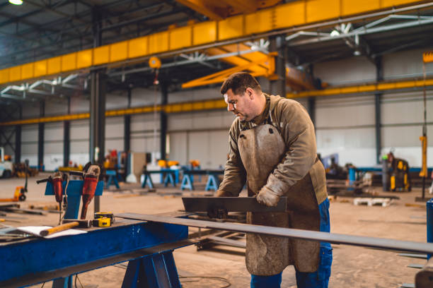 istock Industrial worker measuring the steel plate 2040232000
