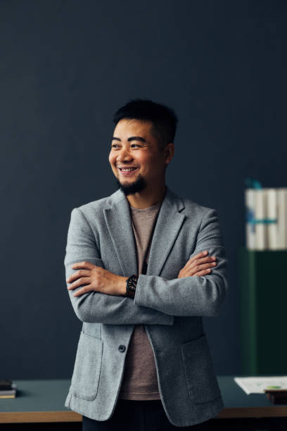 istock Confident Asian Businessman in a Relaxed Office Setting Smiling 2040237458