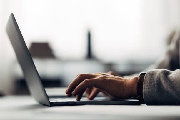 istock Professional Working on Laptop in Modern Office Setting Close-Up 2040237466