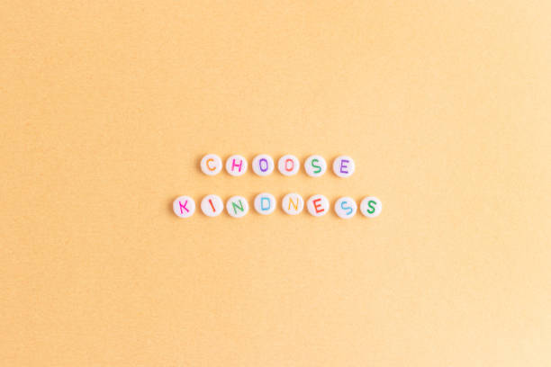 istock Quote Choose kindness made of round beads with multicolored letters. 2040238568