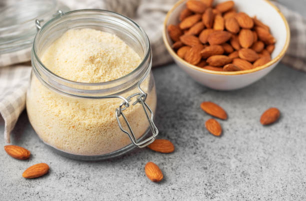 istock Fresh almond flour in a  glass jar and almonds 2040238575