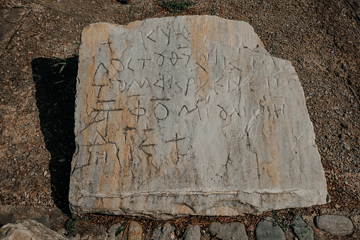 Ancient Greek writings chiseled on stone. Sandikli Turkey