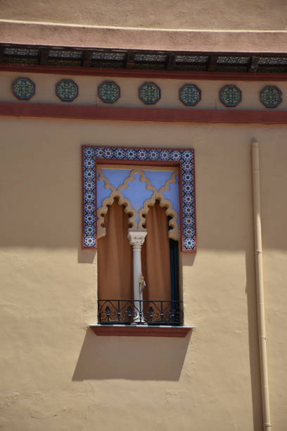 istock window in a yellow arabian style wall with column and mosaic tiles 2040252229