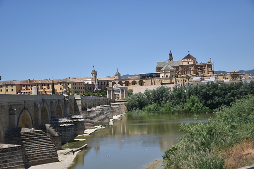 panoramic view of cordoba with the roman bridge and the river with blue sky