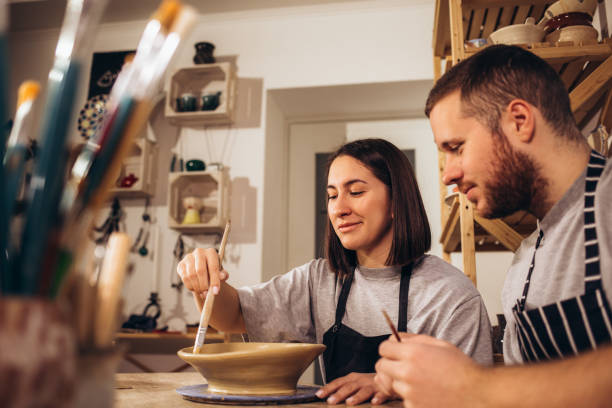 istock A happy young couple paints dishes at a pottery class 2040258373