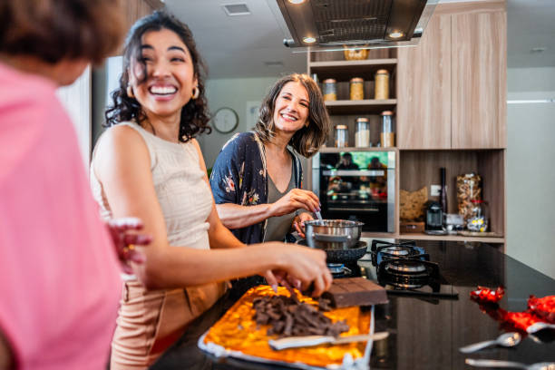 Family making chocolate eggs to celebrate Easter at home