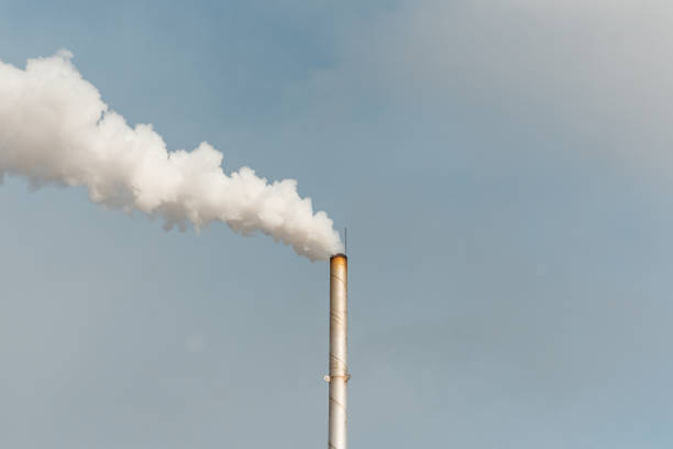 istock Pipe and smoke.Polluting air with white smoke from industrial chimney outdoors. CO2 emissions.Copy space. 2040273320