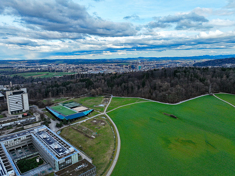 Aerial view from Hönggerberg over north part of Swiss City of Zürich with university campus on a cloudy winter afternoon. Photo taken February 24th, 2024, Zurich, Switzerland.