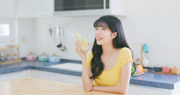 asian woman enjoy drink lemonade