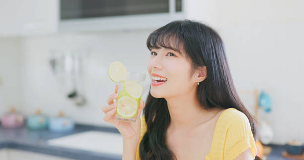 istock asian woman enjoy drink lemonade 2040286332