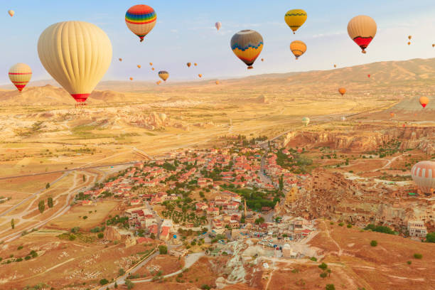 istock Cappadocia air balloons flying at dawn in Turkey 2040287496
