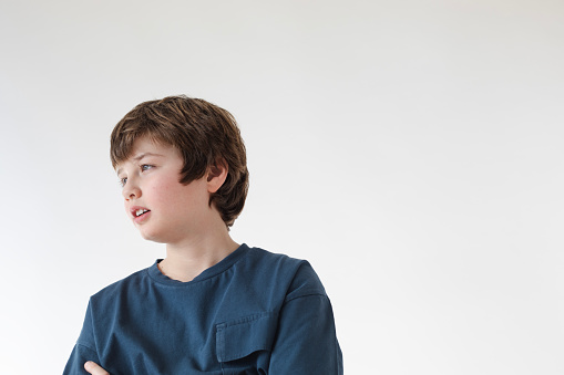 Young caucasian boy isolated over white background.