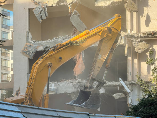 istock Excavator Working On a Demolition on apartment, dust particules 2040304749